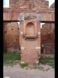 06864 ostia - regio i - insula ix - caseggiato del larario (i,ix,3) - lararium - 09.2022.jpg